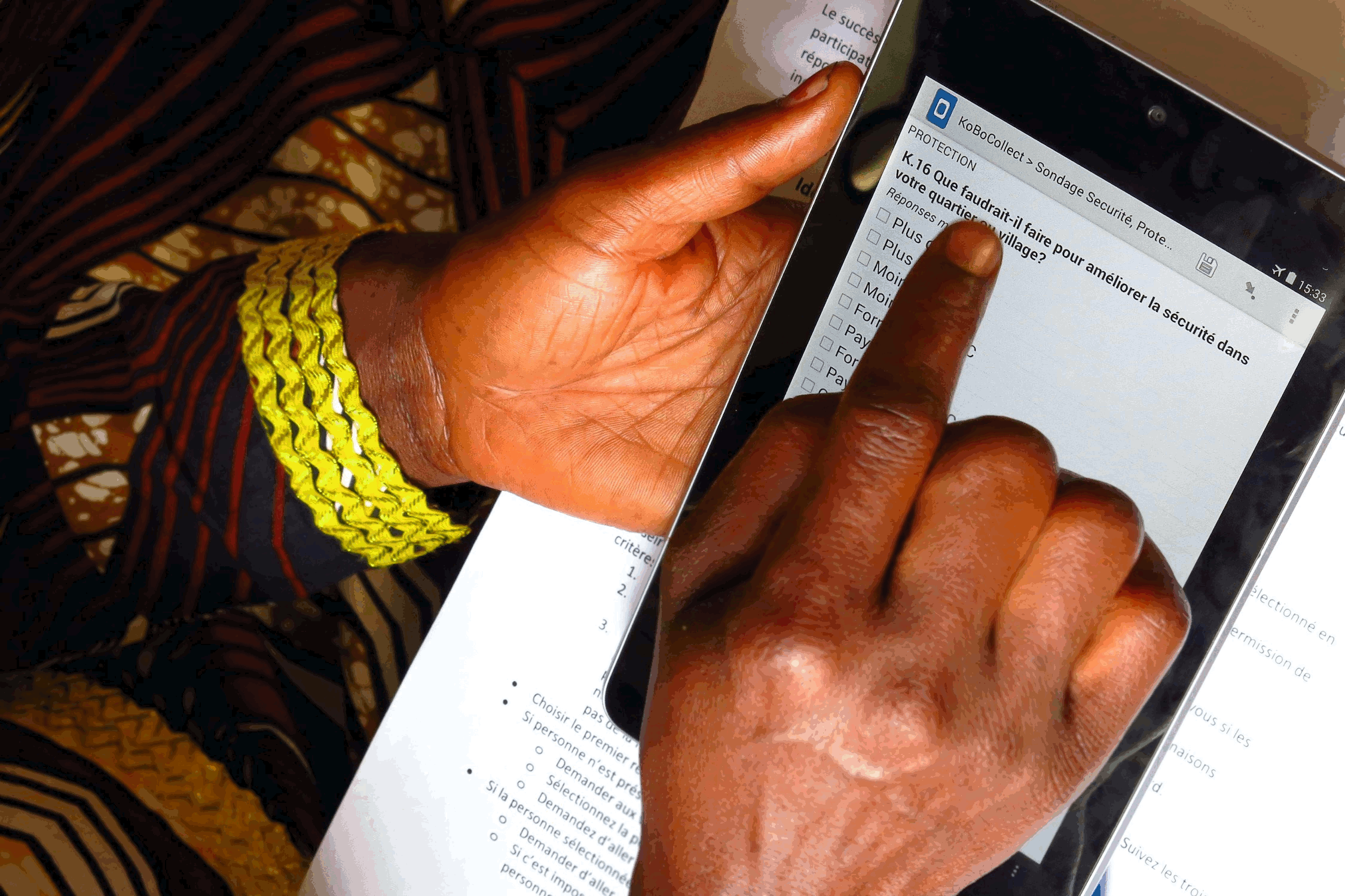 A women filling a form on a mobile device.